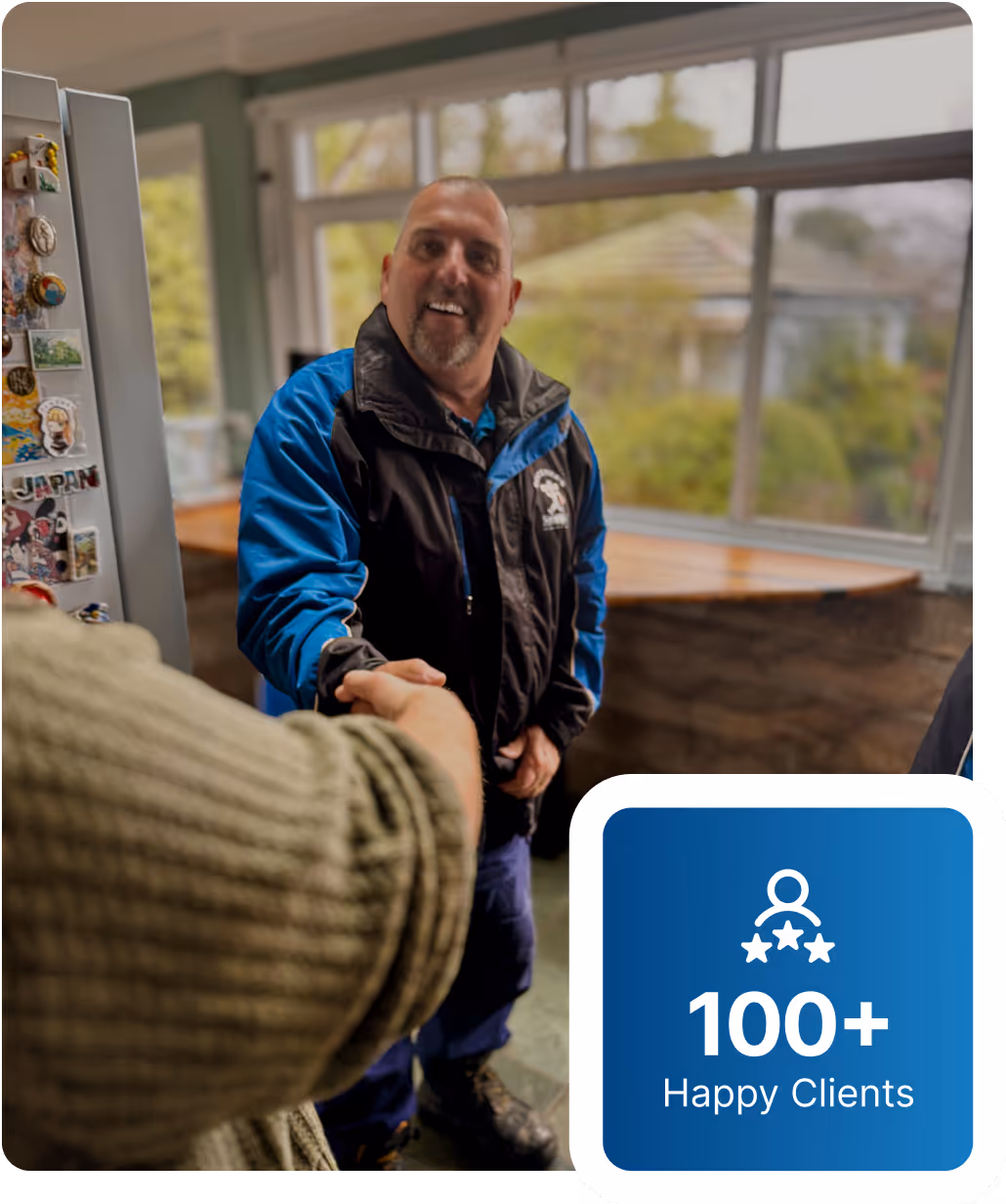 Local Katoomba plumber discussing plumbing quote with homeowner at their property.